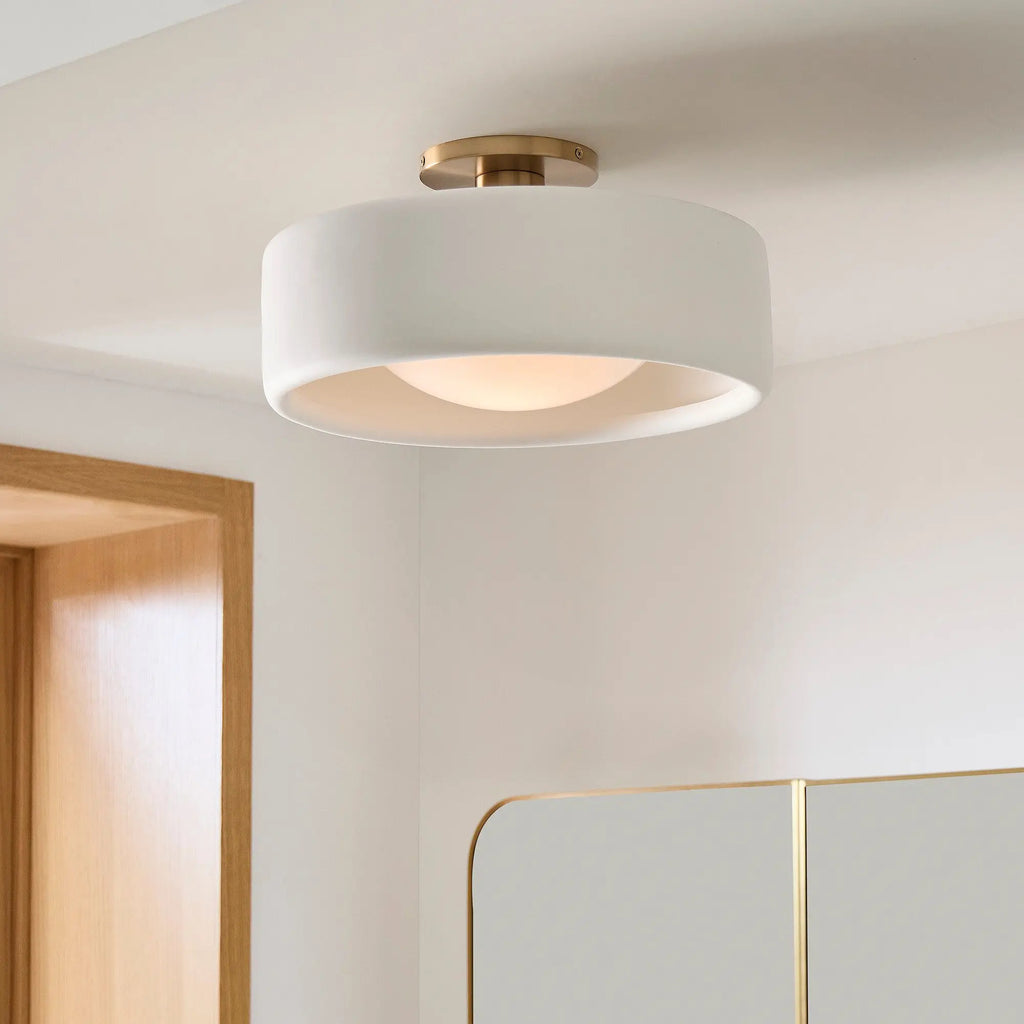 hallway light, white walls, gold mirror