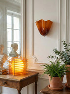 amber sconce paneled wall