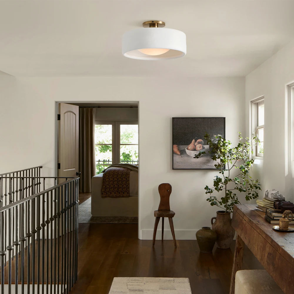 hallway light, wooden console, metal railing