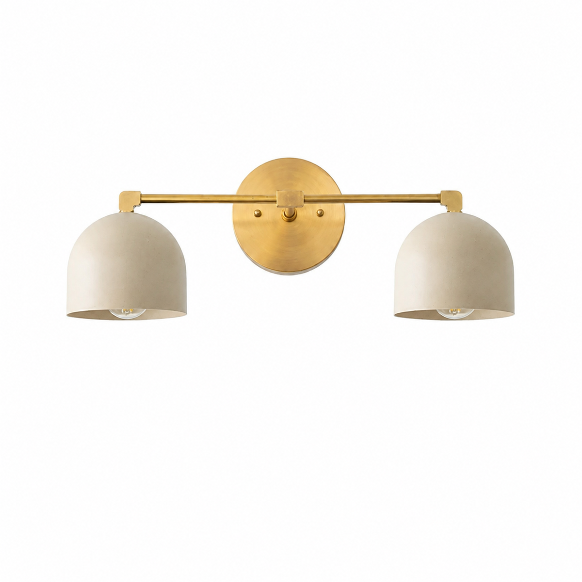 A modern two-light wall sconce with a brushed brass horizontal bar and circular wall mount, featuring two dome-shaped off-white shades, shown against a plain white background.