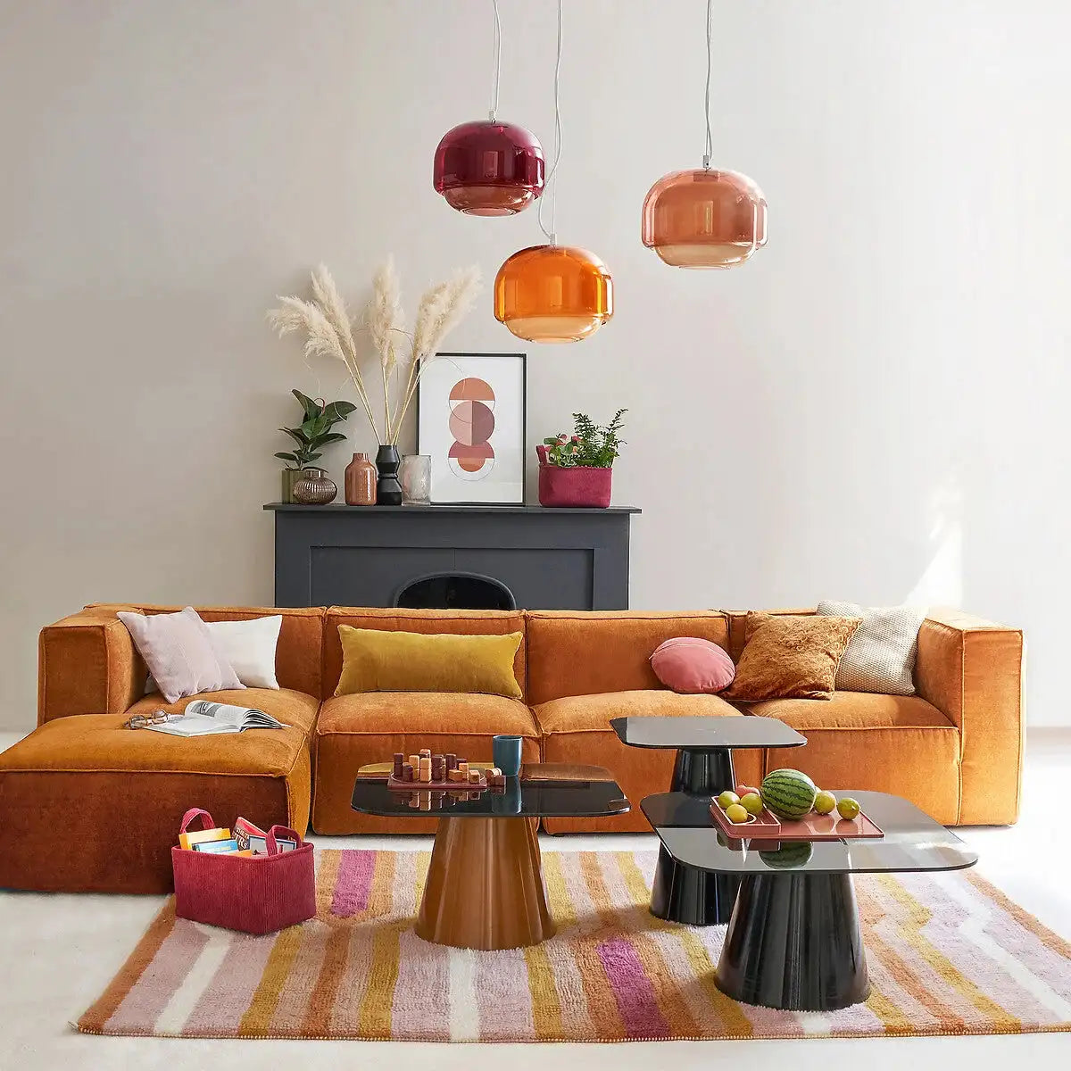 Bright Scandinavian living room with colored glass pendant and floor lamps
